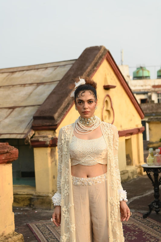 "Knurl" cape, Bustier & flared pants