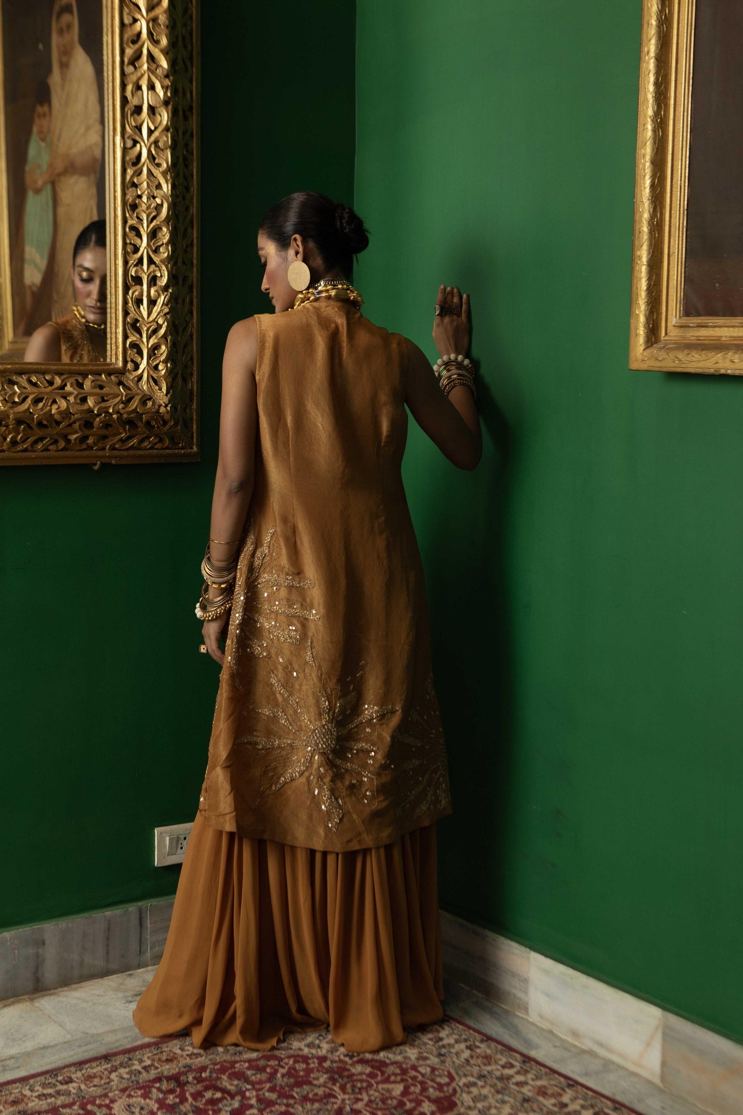 "Wisp" Cape with Embroidered blouse and pleated pant.