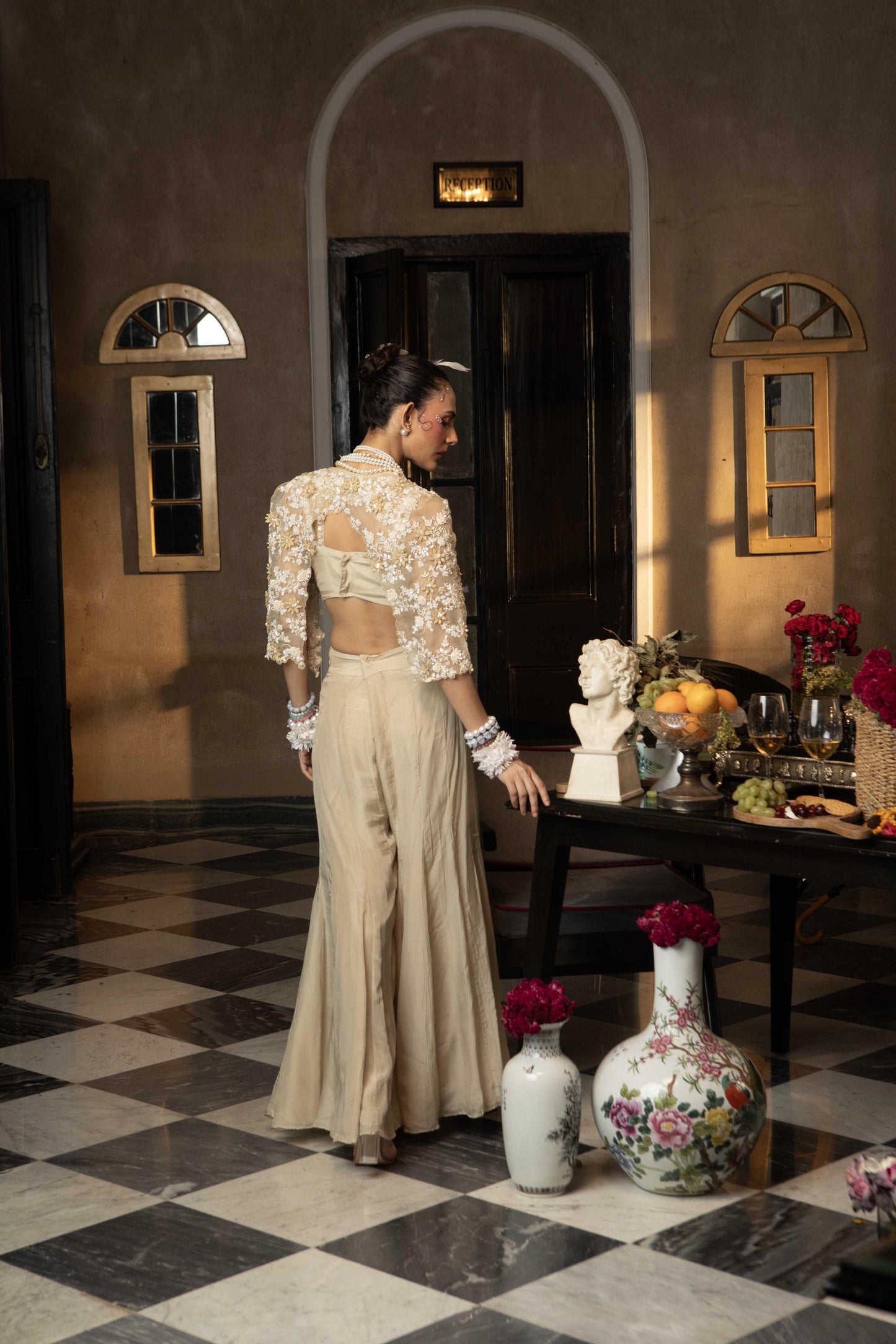 "Twine" cape with embroidered blouse and pants