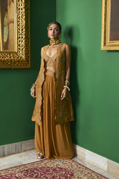 "Wisp" Cape with Embroidered blouse and pleated pant.